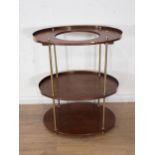 A 19th Century oak or camphor oval Campaign Washstand with brass rim and supports, collapsible for t