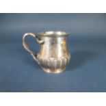 A George V silver Christening Mug with gadroon embossing, serpent handle engraved initials, London 1