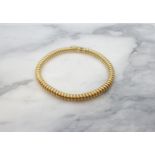 An 18ct gold coil effect Bracelet, approx 18.60gms