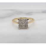 A Diamond Cluster Ring tension-set nine princess-cut stones in 18ct gold, ring size T