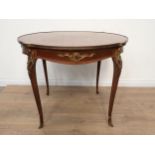 A French mahogany Centre Table with a gilded metal edge and gilt mounts to the slender cabriole supp