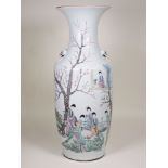 A famille rose baluster Vase with head and ring moulded handles, decorated with figures in a landsca