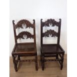 Two 17th Century and later oak Derbyshire Chairs both with scroll carved double back rails, one show