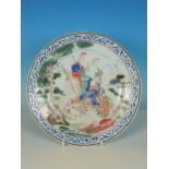 A Chinese famille rose Plate, decorated figures and cherubs with chariot in a landscape, 9in diamete