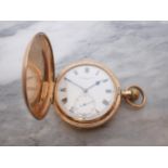 A 9ct gold cased Hunter Pocket Watch the white enamel dial with roman numerals and subsidiary second