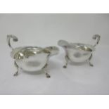 A pair of Victorian silver Sauce Boats with shaped rims, leafage scroll handles on hoof feet, London