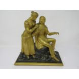 A 19th Century gilt-bronze romantic couple on a naturalistic base, 10½in