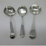 A George V silver Sifting Ladle, Hanoverian pattern with rat tail bowl, London 1912, and two Sauce L