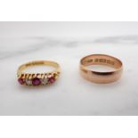 An Edwardian Ruby and Diamond five stone Ring claw-set three cushion-cut rubies interespersed with t