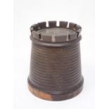 A lignum vitae String Box in the form of a tapering cylindrical castellated tower, 5¼in H