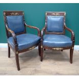 A pair of 19th Century mahogany French Empire Elbow Chairs with gilded metal wreath and cornucopia m
