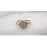 A Diamond Daisy Cluster Ring rubover-set seven brilliant-cut stones in 18ct gold, ring size J, appro