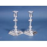 A pair of Edward VII silver Candlesticks with detachable sconces, knopped stems on chamfered square