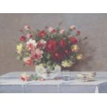 MARKO VUKOVIC (1892-1973). Flowers in a Vase on a table, signed, oil on canvas board, 12 x 15½in