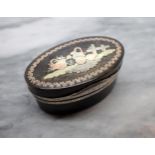 A 19th Century oval tortoiseshell Snuff Box the hinged lid inlaid piqué vignette with white metal mo