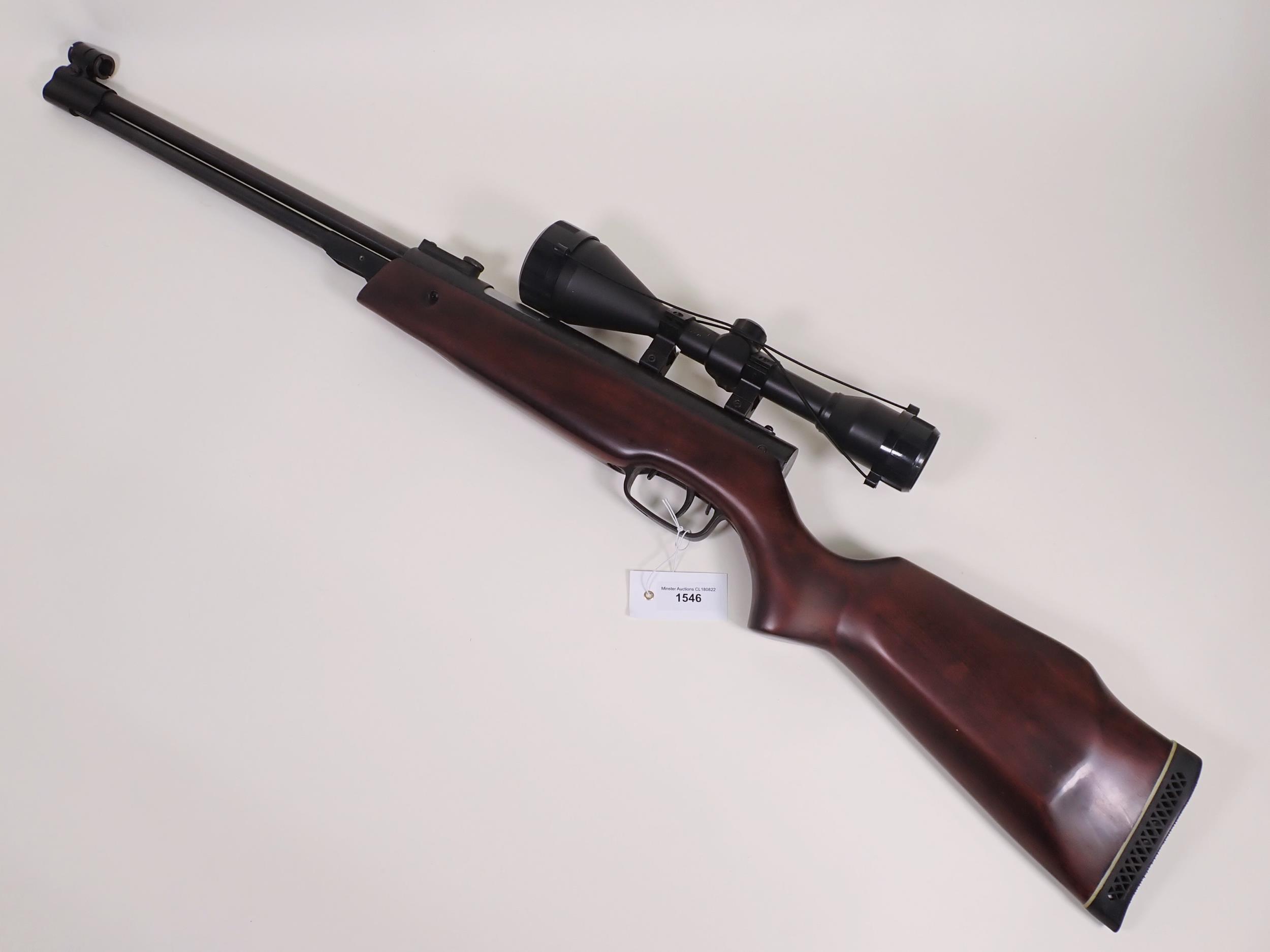 An SMK XS36-1 .22 Air Rifle with 8x56 telescopic sight and case