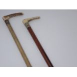 A Malacca antler handled Hunting Whip with braided leather thong and another Hunting Whip with