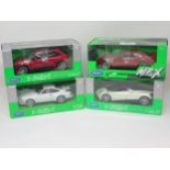 Four boxed Nex 1:24 and 1:26-27 scale Models including Chevrolet Camaro, Pagani Huayra, Porsche