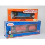 A boxed Lionel 0 gauge Thomas the Tank Engine Series Locomotive 'Thomas' and a boxed 'James'