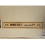 A contemporary hand painted Sign 'Hardy Bros (Alnwick) Ltd, No.6' 4ft L x 7 1/2in H