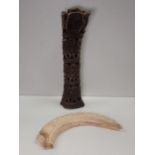 A carved Hippo Tusk and a Shin Bone