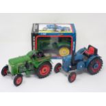 A boxed Lanz Bulldog 4016 Tractor, an unboxed Lanz Bulldog Tractor and an unboxed Fendt Dieselross
