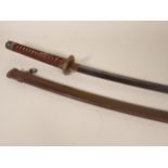 A Japanese Katana by Ishido Teruhide in WWII military mounts. This smith was descended from the
