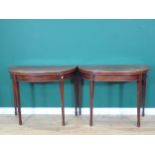 A pair of 19th Century mahogany demi-lune Card Tables with moulded fold-over tops and green baise