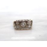 A Diamond five stone Ring pavé-set old-cut stone (chipped) between two pairs of smaller stones,