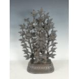 An Indian deity group in bronze with goddesses upon a kylin with leafage background 17in H,