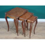 A nest of three French Tables with shaped rectangular tops having parquetry inlay and edged in