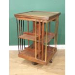 A 19th Century walnut revolving Bookcase with brass and wooden uprights 2ft 6in H