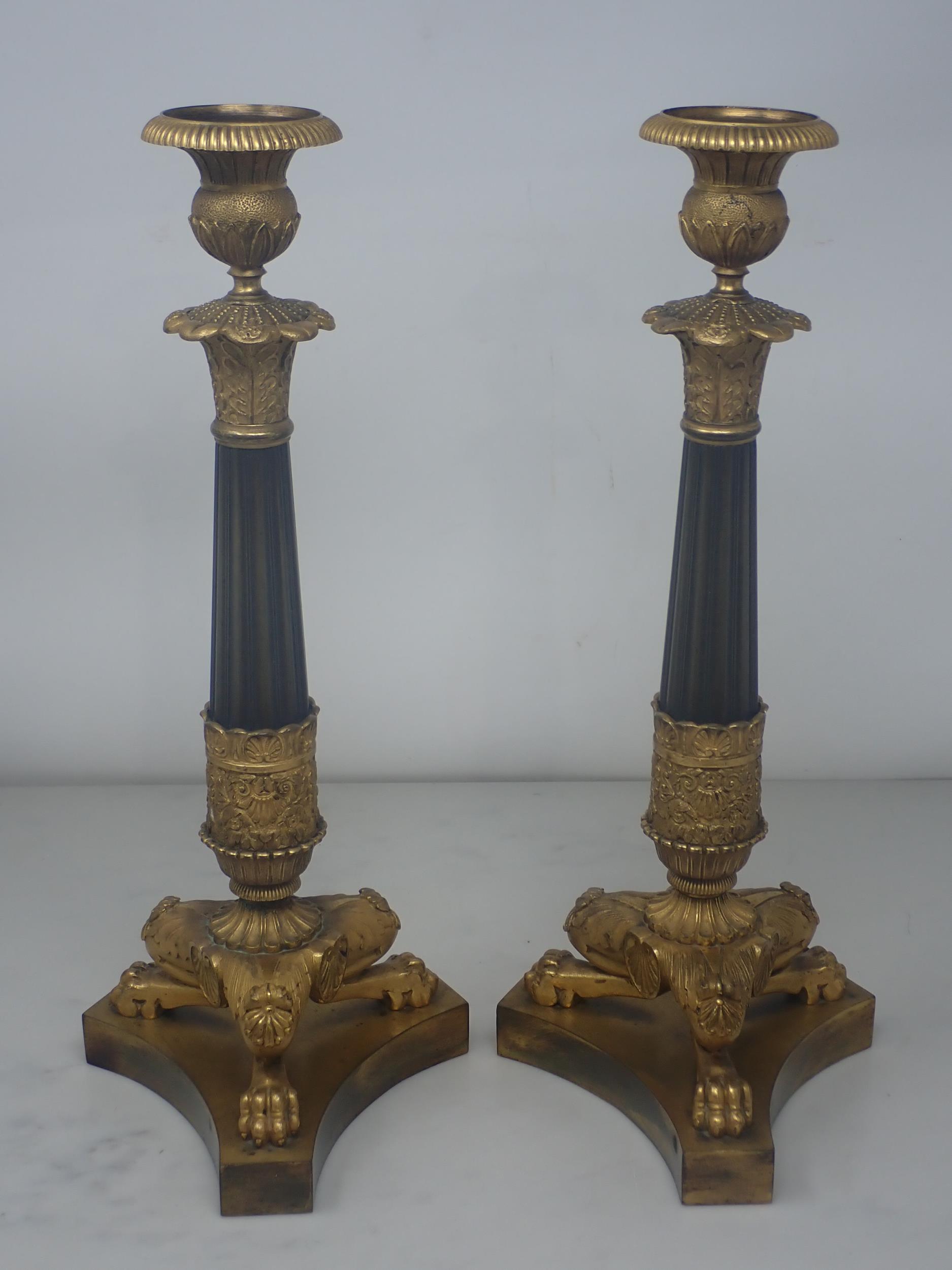 A pair of French Empire Candlesticks in ormolu and bronze, with classical mouldings, plain bronze - Image 2 of 5