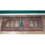 A Persian Prayer Rug, multi-bordered and with seven mihrabs of differing designs, 7ft 9in L x 2ft