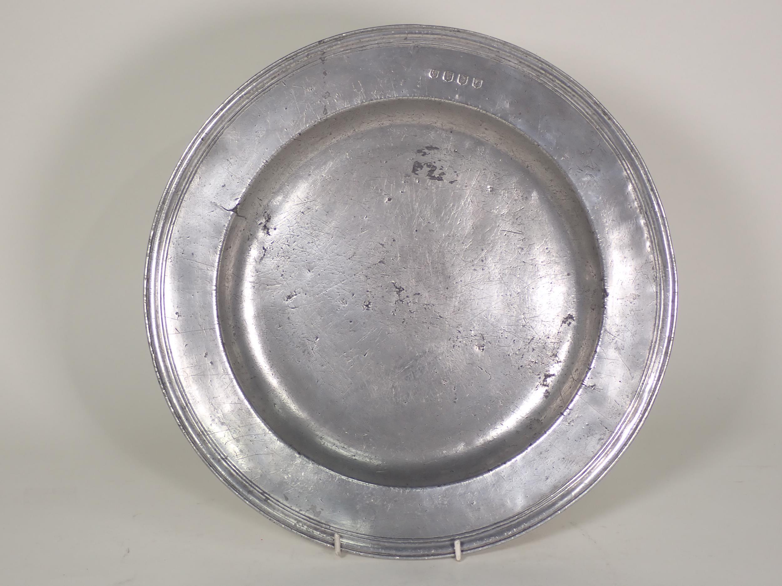 A c.1700 Pewter Charger with touchmarks for John Silk, with reeded edge, 13 1/2in diam