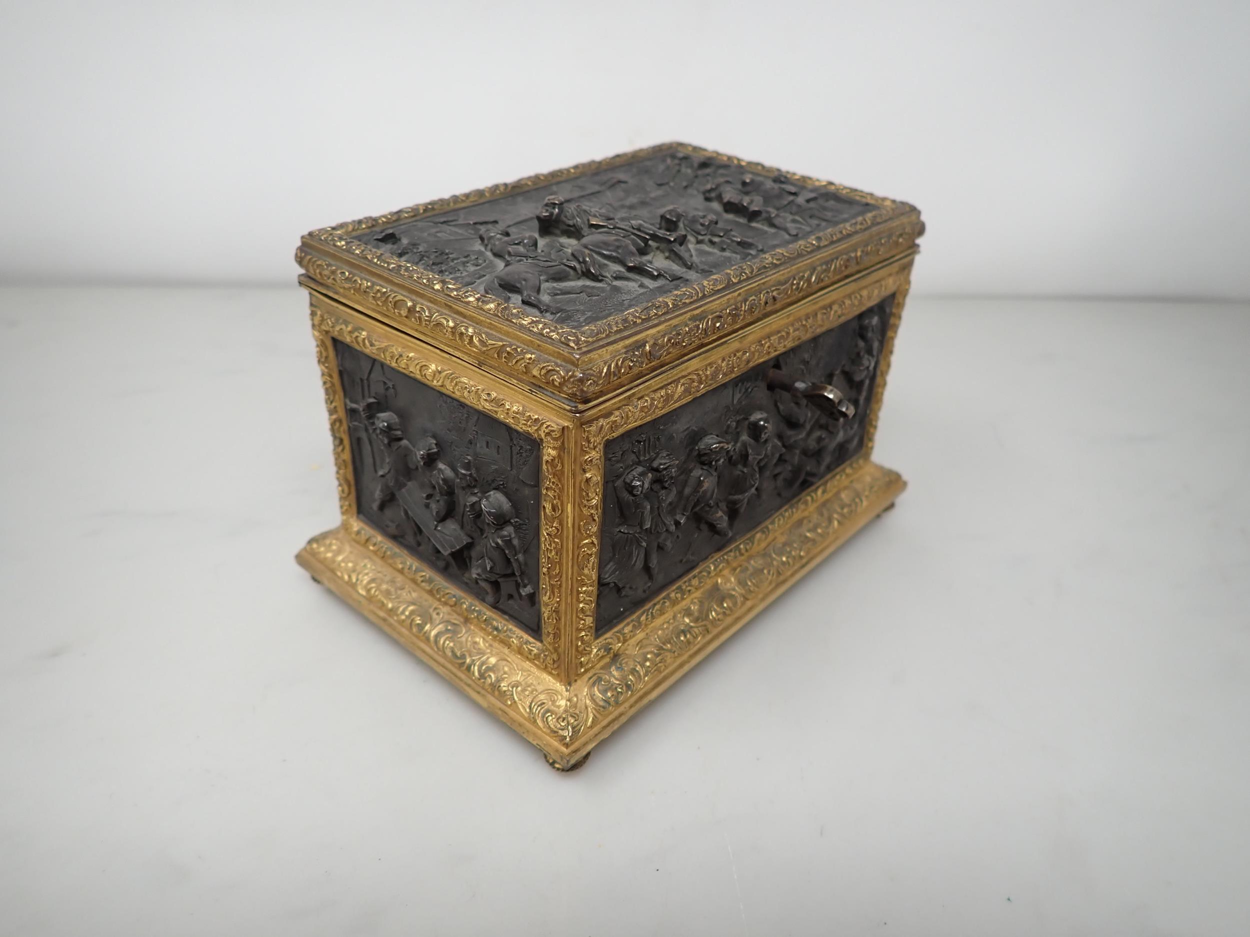 A 19th Century French gilt-metal and bronzed Casket, the inset panels decorated figures merrymaking, - Image 4 of 6
