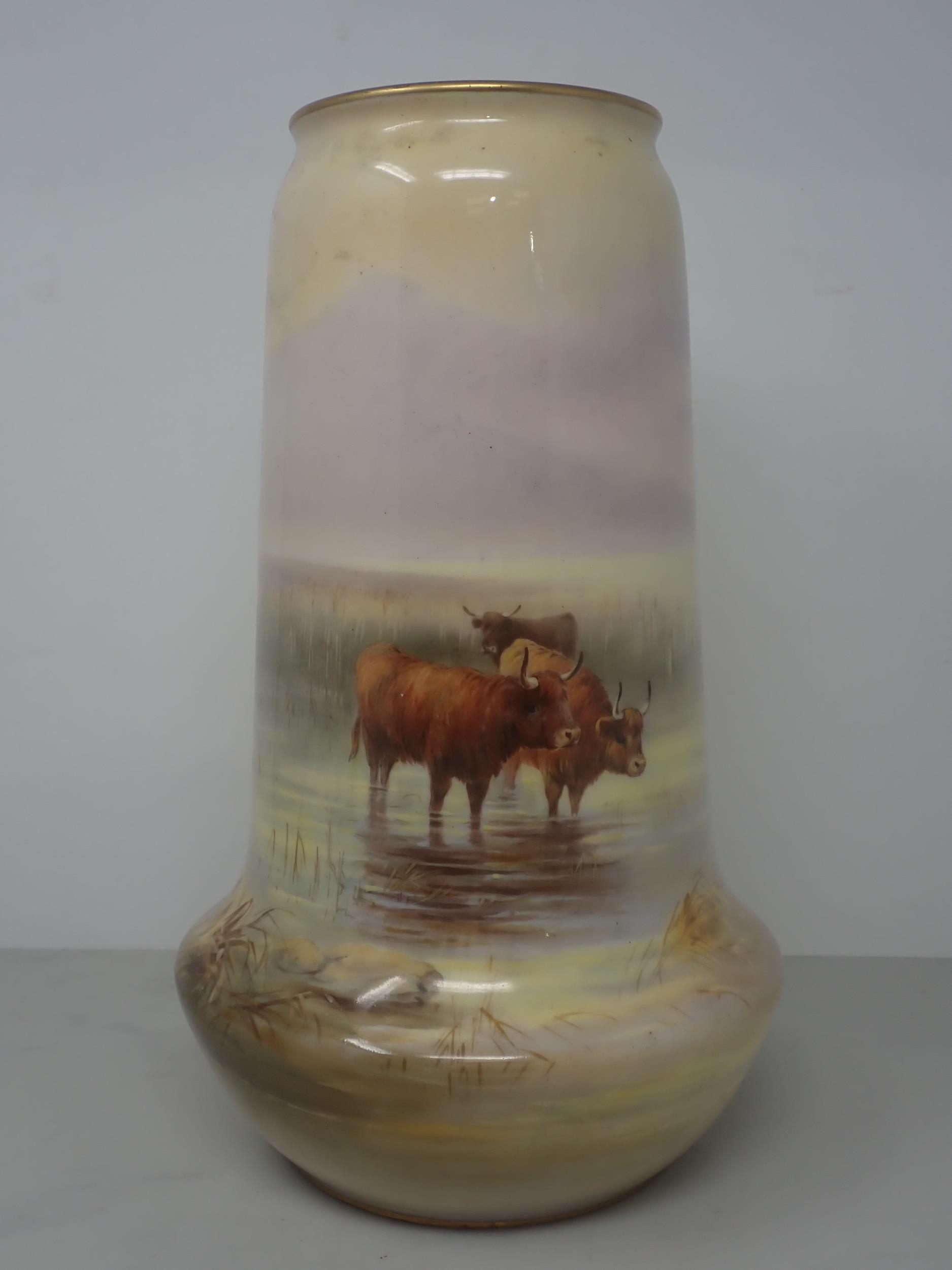 A Royal Worcester Vase, signed H. Davis (Harry Davis), painted highland cattle stood in a stream,