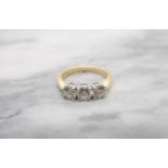 A Diamond three stone Ring claw-set brilliant-cut stones, total diamond weight 1.23cts, in 18ct