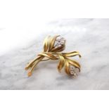 A Diamond Flower Spray Brooch claw-set eight brilliant-cut diamonds in 18ct gold, 40mm long,