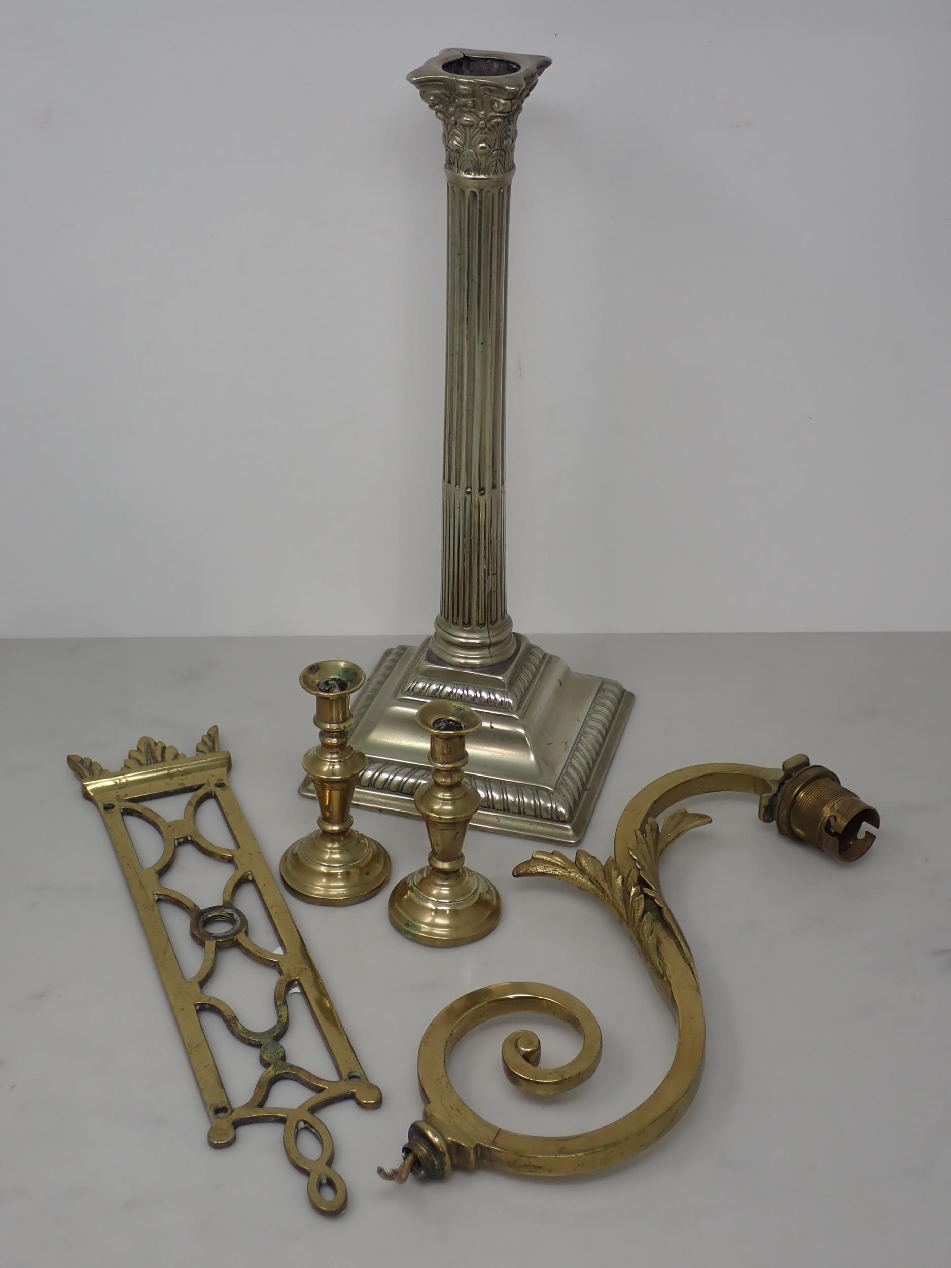 A Candlestick, possibly Paktong, with stop fluted column and square base 111/2in H, a pierced