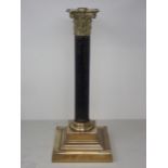 An Empire style Table Lamp with brass capital, ebonised reeded column and square base, 17in H