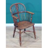 A 19th Century ash and elm Windsor Elbow Chair with pierced splat back mounted upon turned
