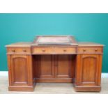 An unusual Clerk's Desk in walnut by James Shoolbred & Co with central sloping hinged desk flanked