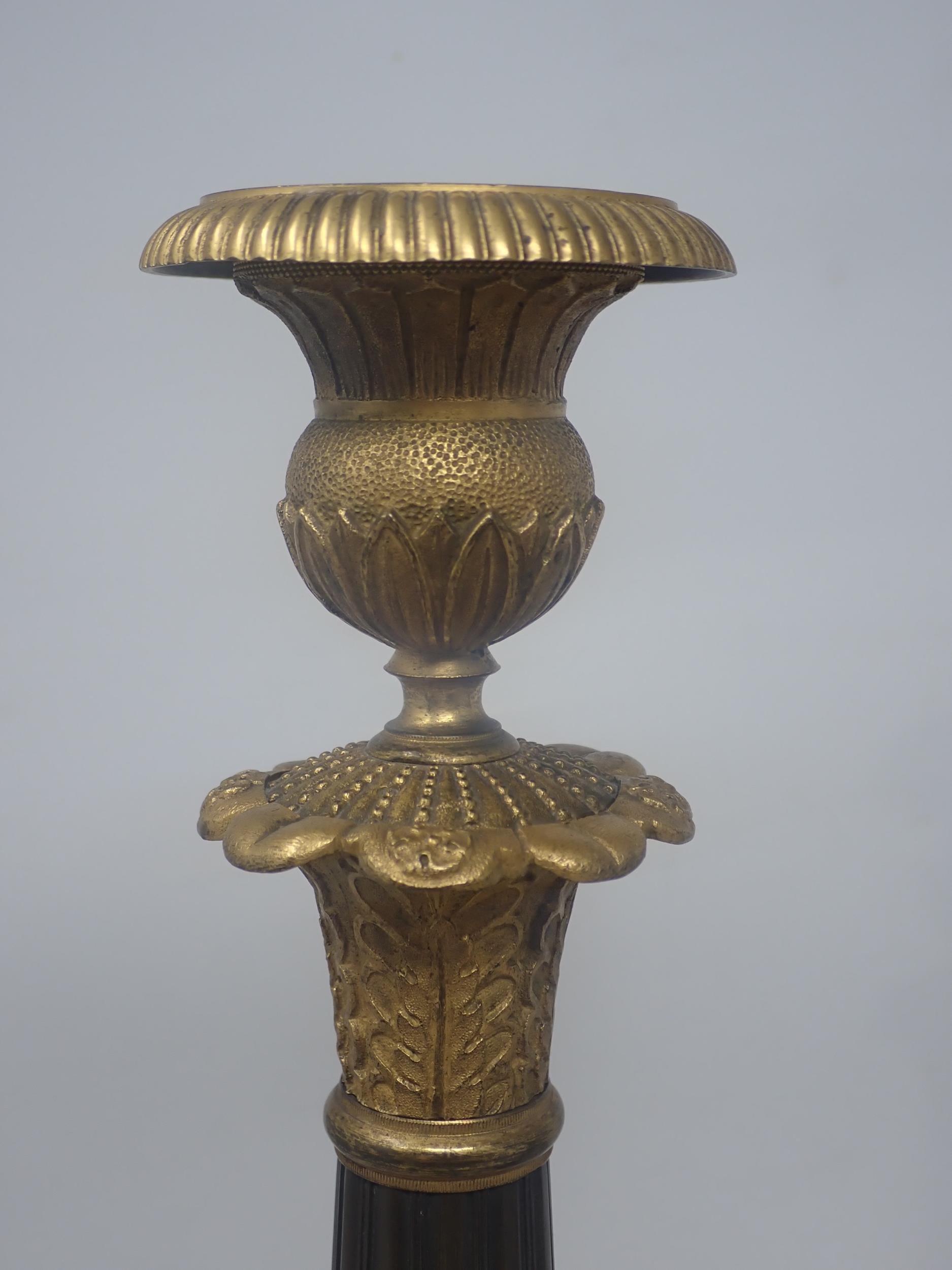 A pair of French Empire Candlesticks in ormolu and bronze, with classical mouldings, plain bronze - Image 5 of 5