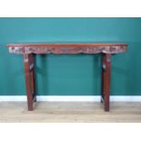 A Chinese hardwood Altar Table with carved scroll, leafage and fruit designs to the rails on tall