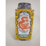 A Chinese square section Vase painted iron red dragons amongst clouds, yellow ground surround,