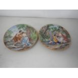 A pair of Italian Maiolica Plates, painted romantic couples in landscapes 'Rinaldo and Armida'