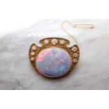 A mid 20th Century Opal and Diamond Brooch millegrain-set oval opal within graduated brilliant-cut