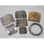 A collection of small Chinese items including five silver Buckles, a gilt metal Buckle and a child's