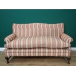 A Georgian style camel back Sofa with red and gold striped upholstery mounted upon walnut cabriole